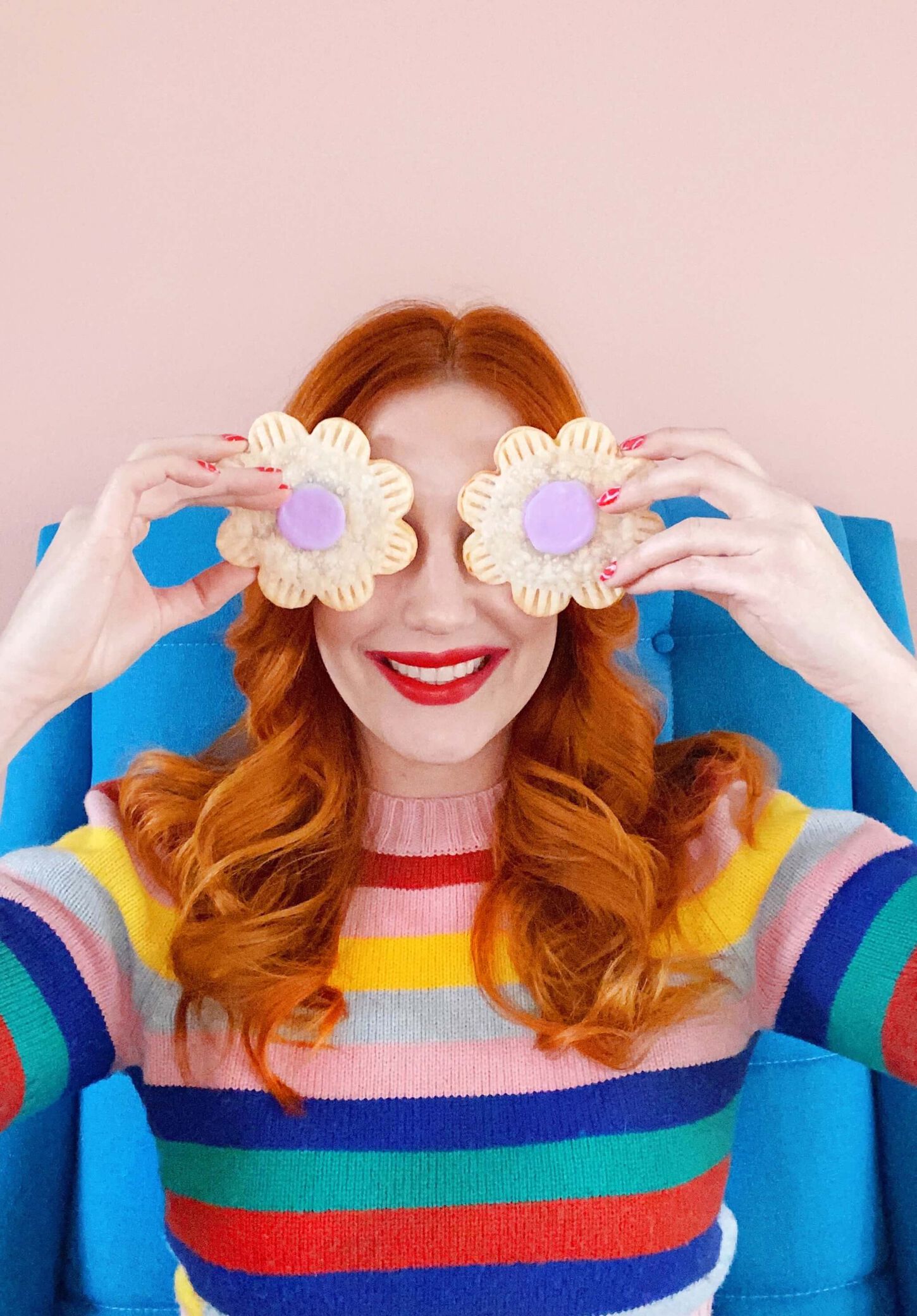 Sarah posing with flowers over her eyes